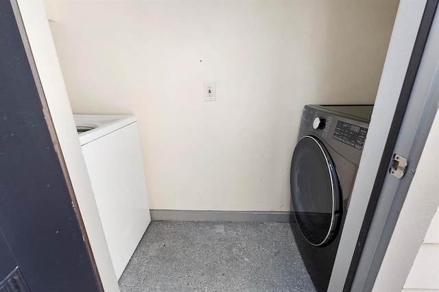 laundry room featuring washer / dryer