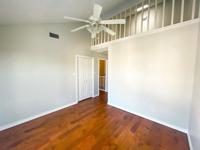 unfurnished room featuring ceiling fan, dark hardwood / wood-style flooring, and high vaulted ceiling