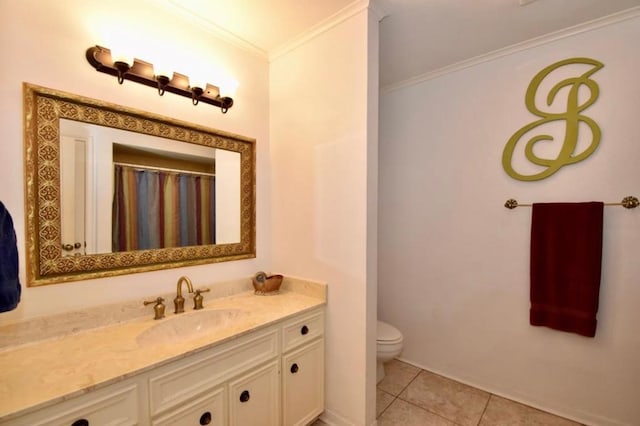 bathroom with toilet, vanity, tile patterned floors, and crown molding