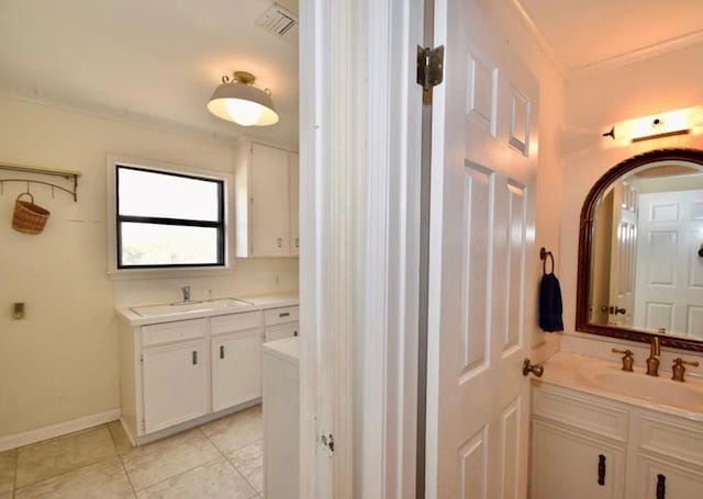 bathroom featuring tile patterned floors, vanity, and crown molding