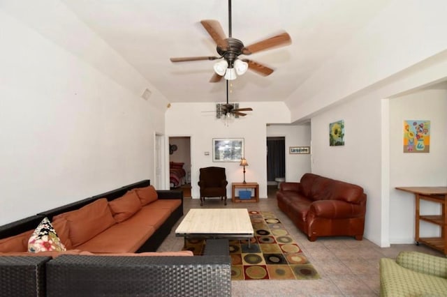 living room featuring ceiling fan and vaulted ceiling