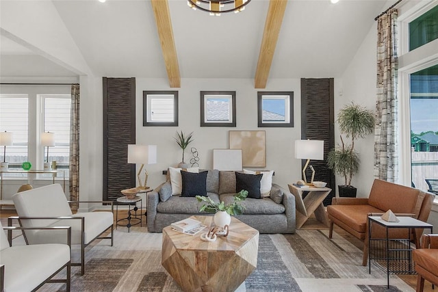 living room with beam ceiling and high vaulted ceiling