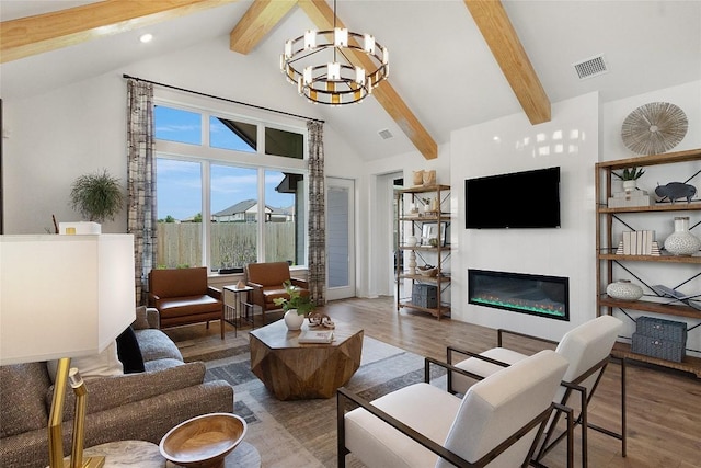 living room with beam ceiling, high vaulted ceiling, hardwood / wood-style flooring, and an inviting chandelier