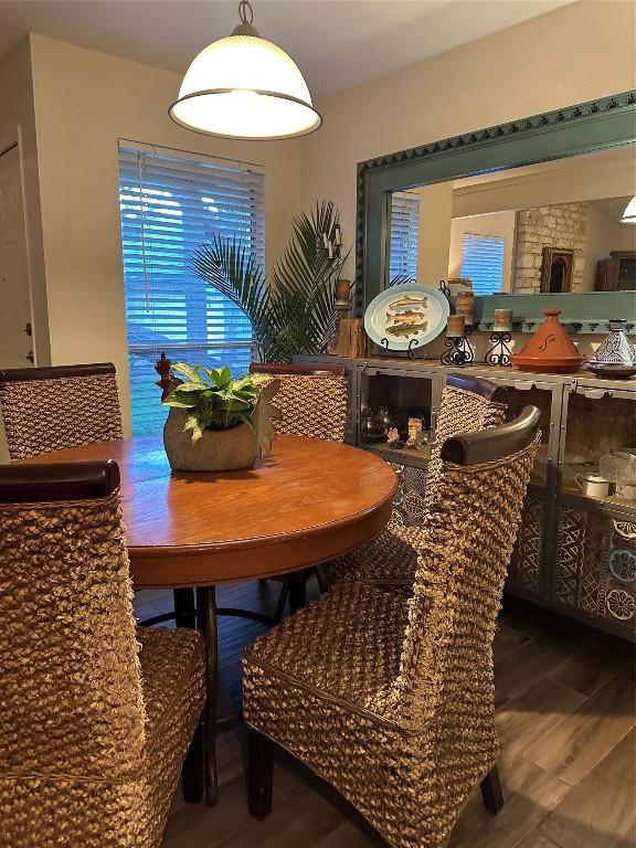 dining space featuring wood finished floors