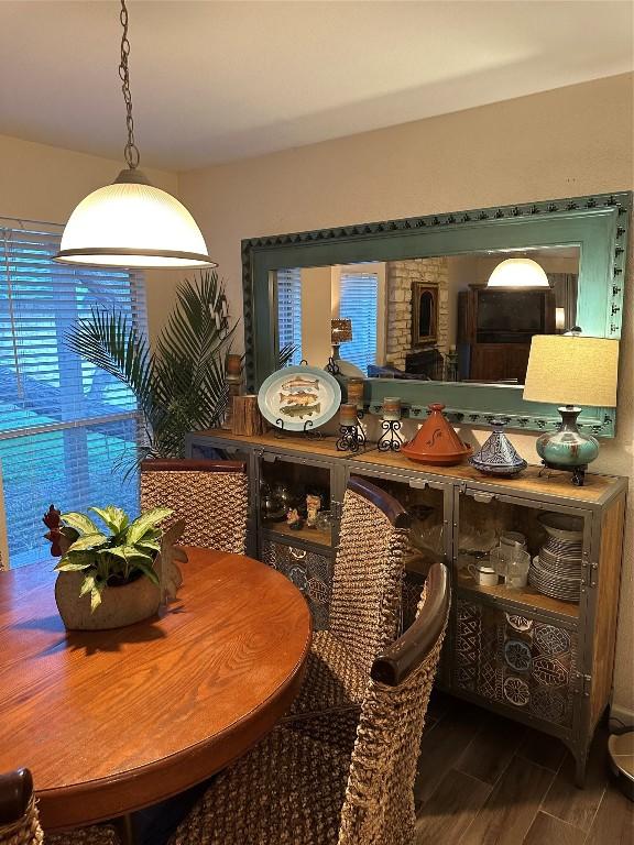 dining area featuring a wealth of natural light and wood finished floors