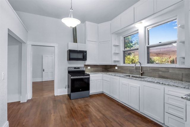 kitchen with sink, decorative light fixtures, electric stove, decorative backsplash, and white cabinets