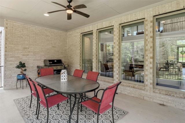 view of patio featuring ceiling fan and a grill