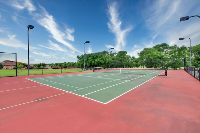 view of sport court featuring basketball hoop