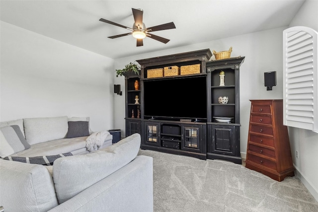 living room featuring light colored carpet and ceiling fan