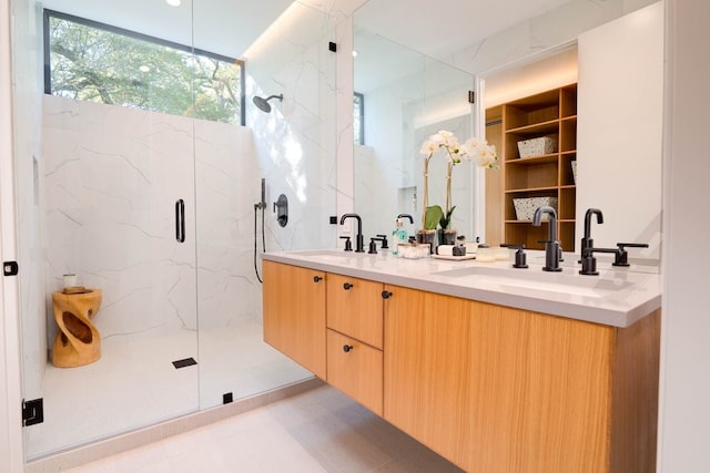 bathroom with a shower with door and vanity