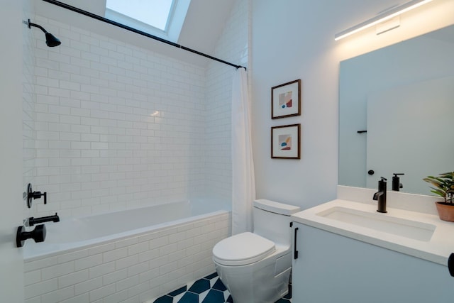 bathroom with vanity, a skylight, and toilet