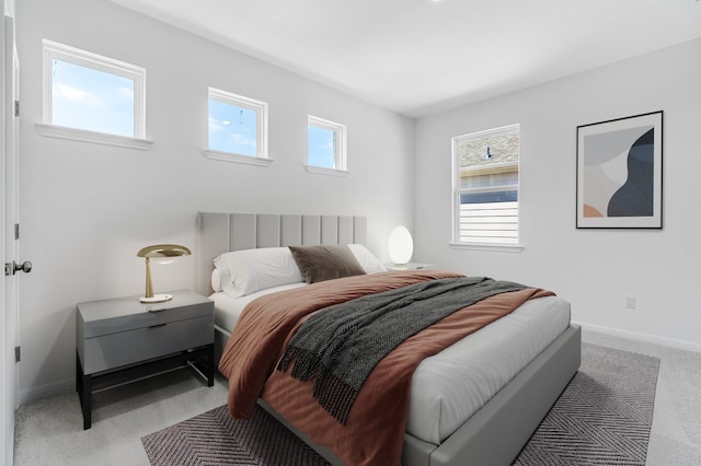 bedroom with baseboards and carpet floors