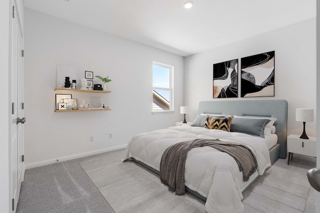 carpeted bedroom featuring baseboards