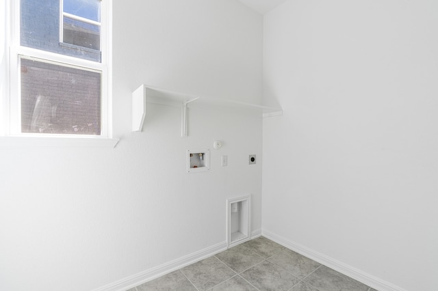 washroom with electric dryer hookup, baseboards, gas dryer hookup, hookup for a washing machine, and laundry area