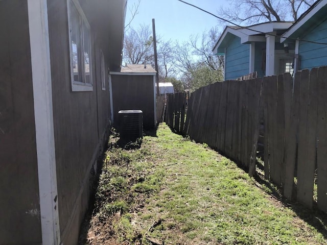 view of yard with central air condition unit