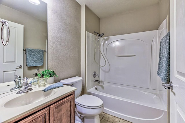 full bathroom with a textured ceiling, vanity, bathing tub / shower combination, tile patterned flooring, and toilet