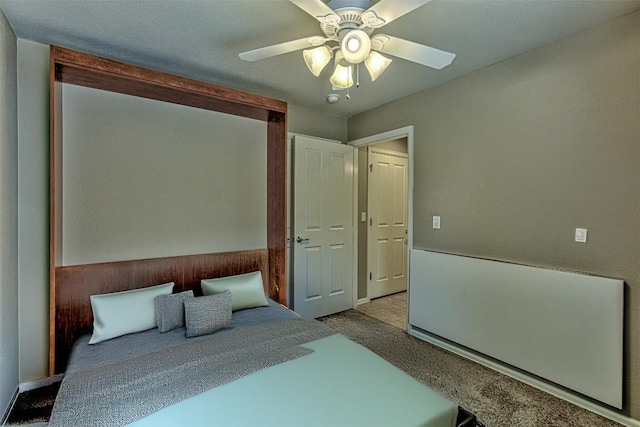 bedroom with light colored carpet and ceiling fan