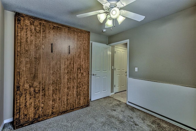 unfurnished bedroom with light carpet and ceiling fan