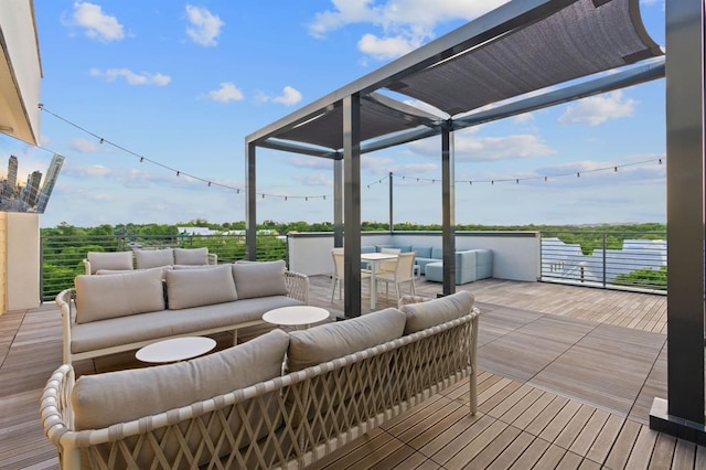 wooden terrace with outdoor lounge area and a water view