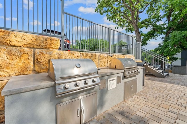 view of patio with area for grilling and an outdoor kitchen