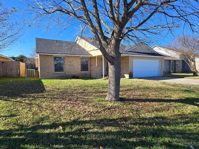 single story home with a garage, central air condition unit, and a front yard