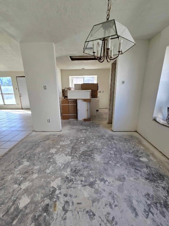 interior space featuring a textured ceiling