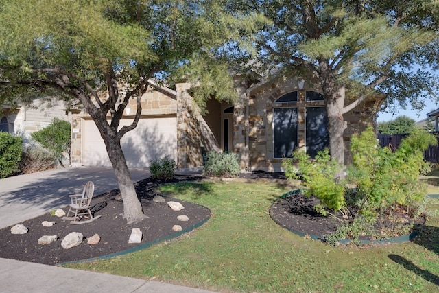 view of front facade featuring a garage and a front lawn