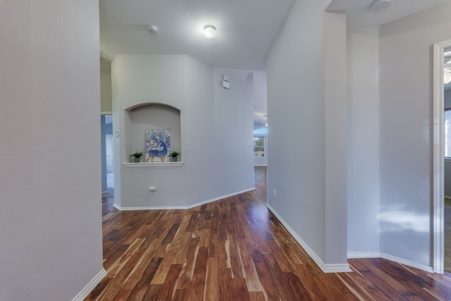 corridor with dark wood-type flooring