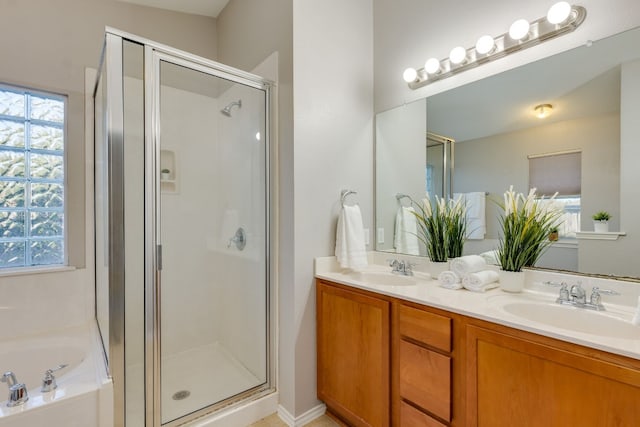 bathroom with shower with separate bathtub and vanity