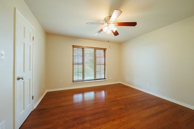 spare room with hardwood / wood-style flooring and ceiling fan