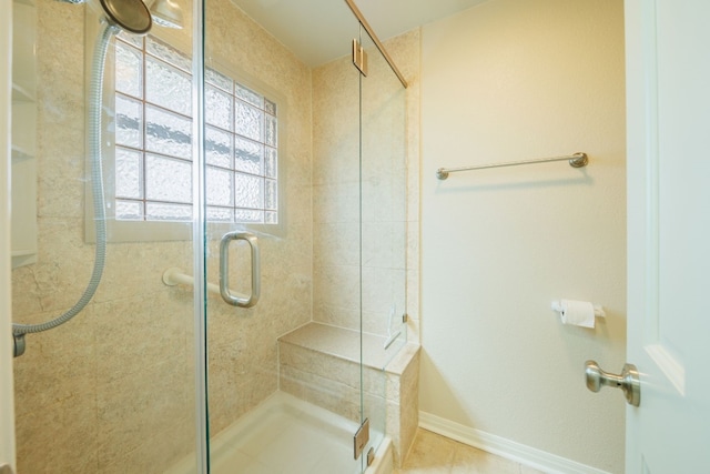 bathroom featuring an enclosed shower