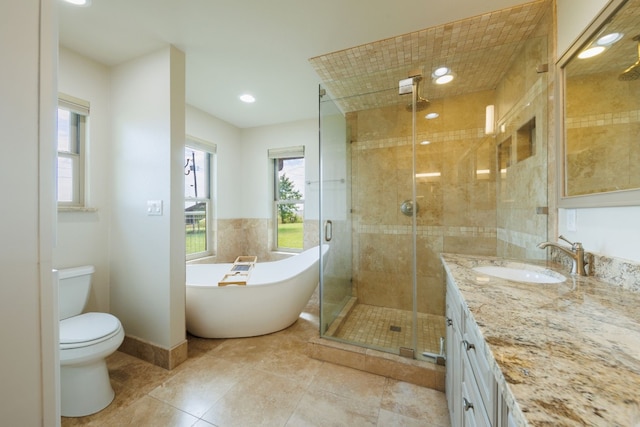 full bathroom with vanity, toilet, and shower with separate bathtub