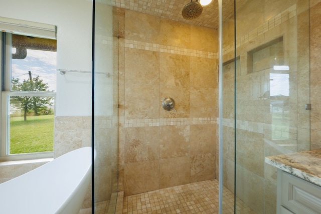 bathroom featuring separate shower and tub