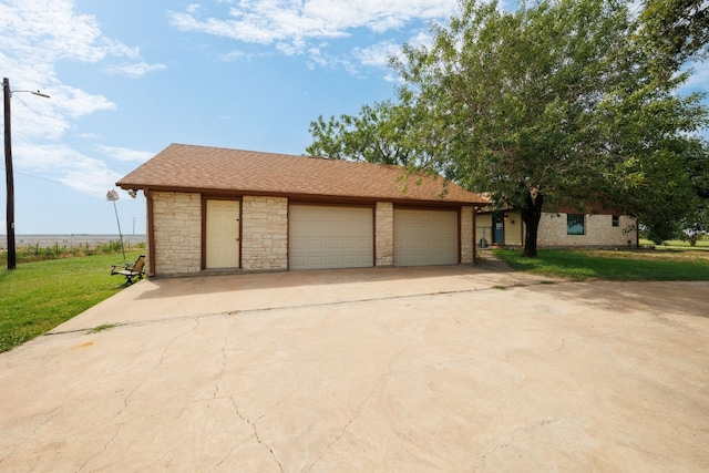 garage with a lawn