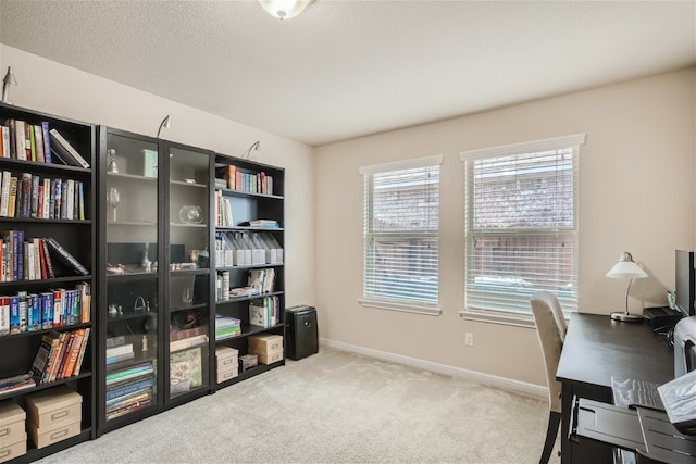 office with carpet and a textured ceiling