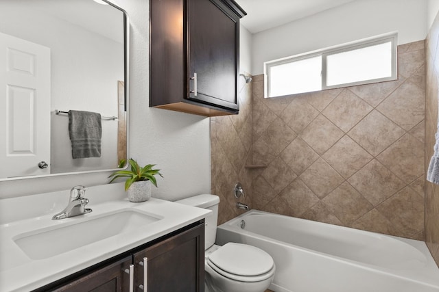 full bathroom featuring vanity, toilet, and tiled shower / bath combo