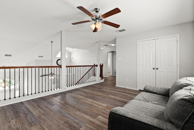 sitting room featuring ceiling fan and dark wood-type flooring