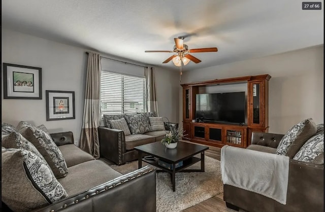 living room with ceiling fan and wood-type flooring