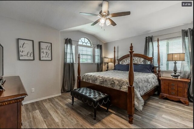 bedroom with hardwood / wood-style floors, vaulted ceiling, and ceiling fan