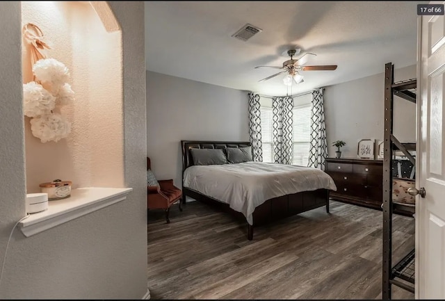 bedroom featuring ceiling fan and dark hardwood / wood-style flooring