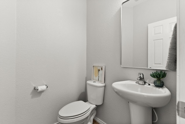 bathroom with sink and toilet