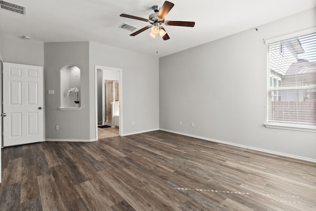 unfurnished living room with ceiling fan and dark hardwood / wood-style flooring