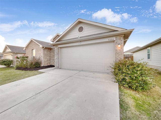 single story home with a garage