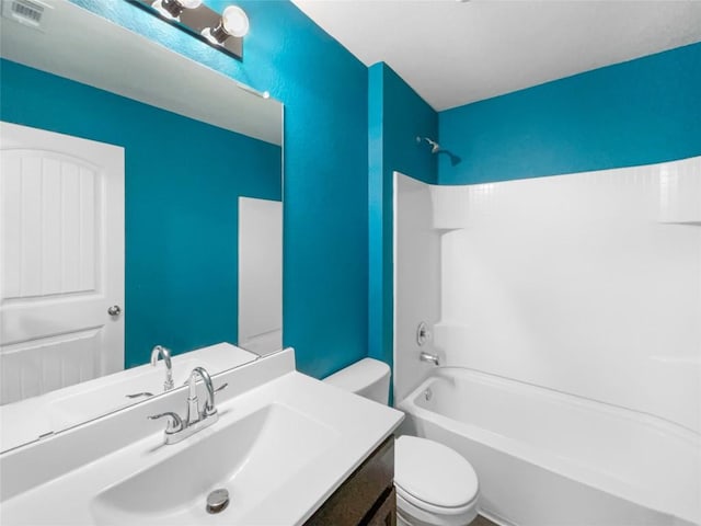 full bathroom featuring shower / bathing tub combination, vanity, and toilet