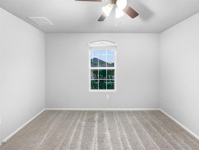 unfurnished room with carpet flooring and ceiling fan