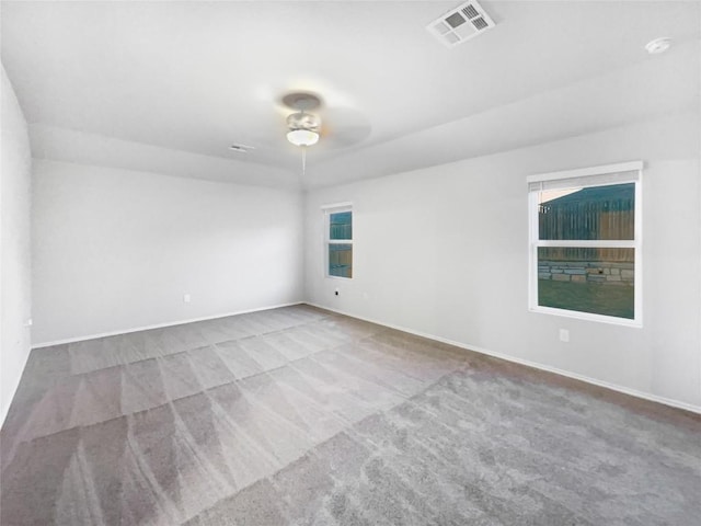 carpeted empty room with ceiling fan