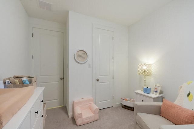 bedroom with light colored carpet