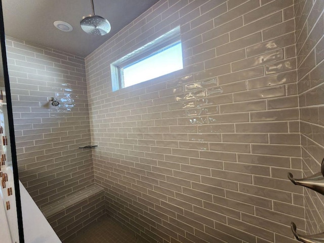 full bath featuring tiled shower