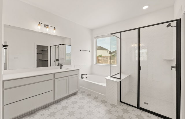 3813 Gabriels Horn Rd, Leander, TX 78641 - full bathroom featuring tile patterned floors, a stall shower, vanity, and a garden tub