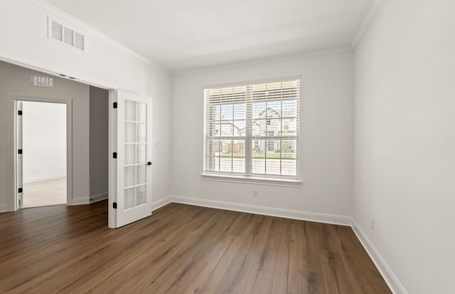 3813 Gabriels Horn Rd, Leander, TX 78641 - empty room with dark wood-style flooring, crown molding, and baseboards